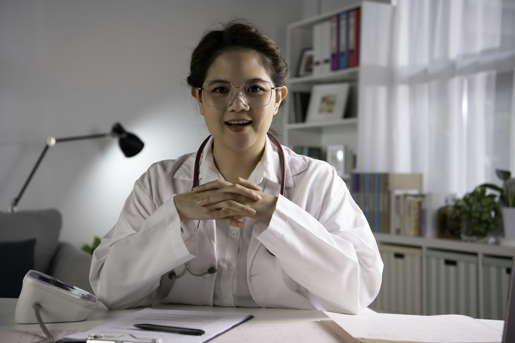 Female doctor making video call